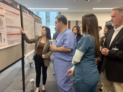 Student presents to faculty during Research Symposium.